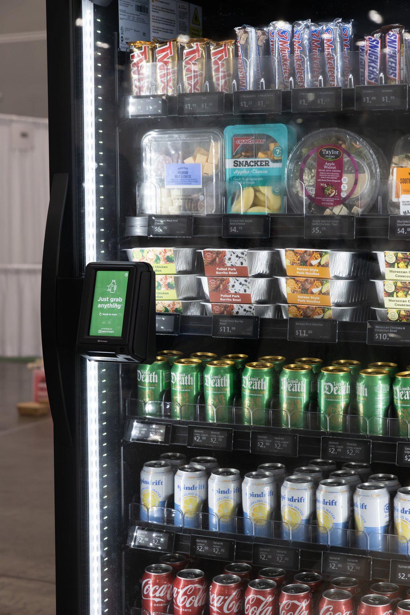 A Smart Store cooler stocked with fresh food, drinks, and snacks