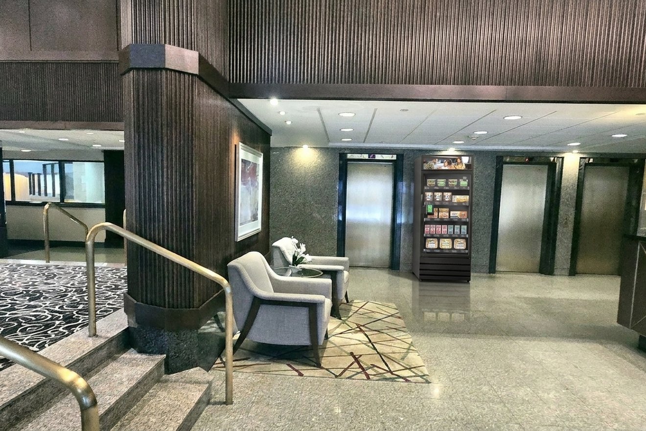 A Smart Store shown by the elevators in a condo lobby